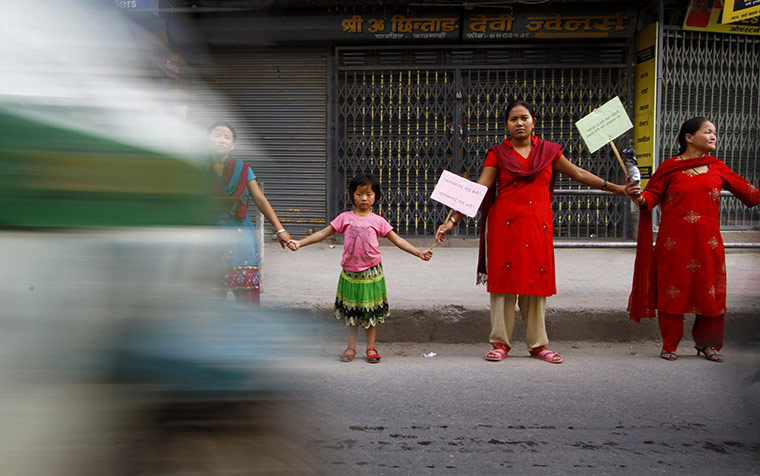 24 hours: Katmandu, Nepal: A child joins women in a rally against child labour