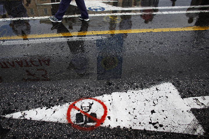 24 hours: Athens, Greece: Graffiti of prime minister George Papandreou on the road 