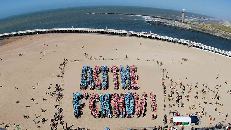 Friends of the Earth: An aerial view shows people forming gian