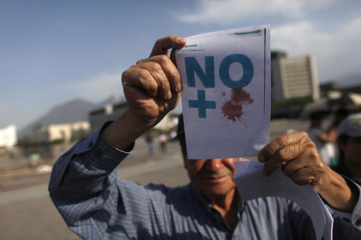 FTA: Tomas Bravo: A man takes part in a demonstration against violence in Monterrey