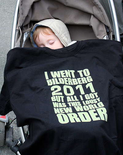 Bilderberg: A budding activist takes time out in his Bilderbuggy