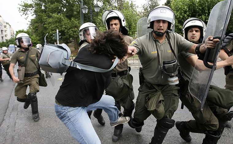 protests in greece: Police arrest a demonstrator near parliament