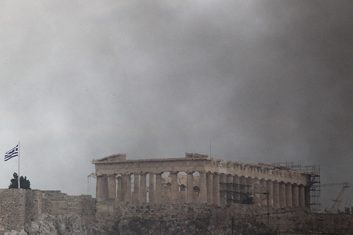 protests in greece: The Parthenon Surrounded By Smoke In Athens