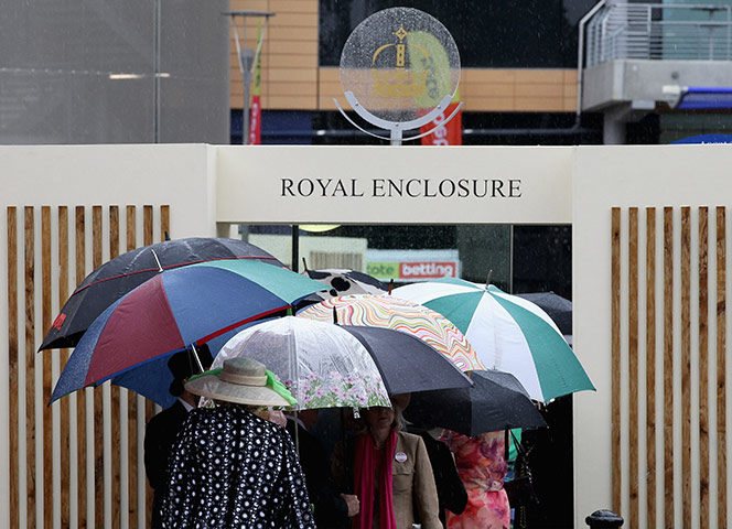 Ascot day three: Racegoers queue in the rain to get into the Royal Enclosure
