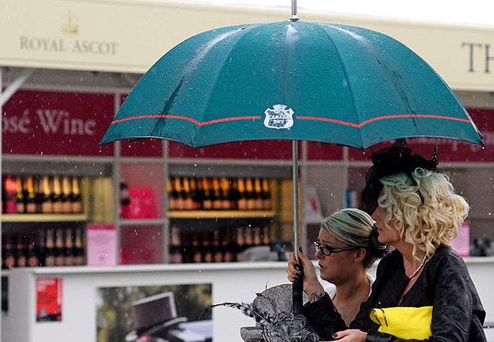Ascot Ladies day: Racegoers arrive to a rainy Ladies Day at the annual Royal Ascot meeting