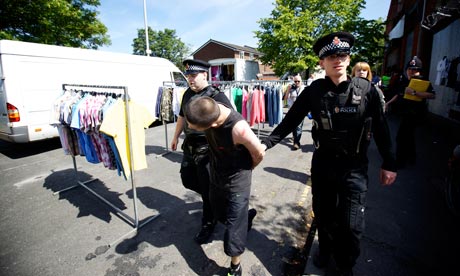 Police carry out Operation Cove on Conrad Street market in Collyhurst, north Manchester 14 June 2011