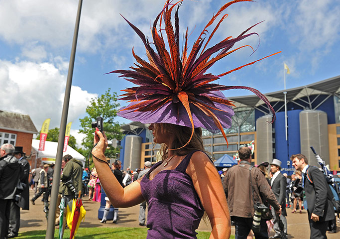 Ascot Ladies Day: A race-goer wearing a flamboyant hat takes a picture