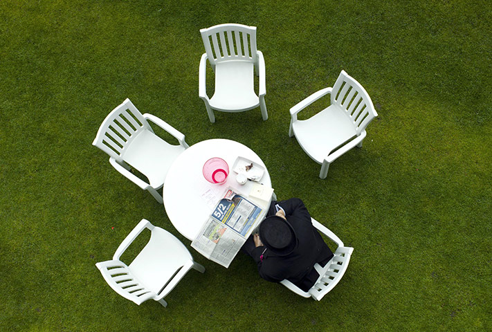 Ascot Ladies Day: A gentleman researches the odds