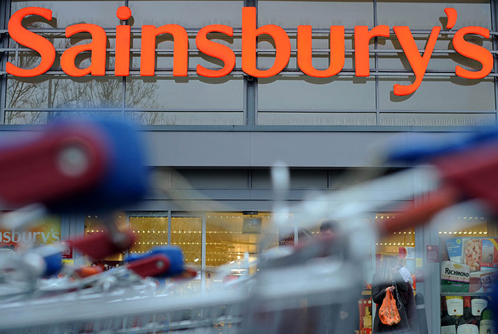 Week in Business: A Sainsbury's logo behind shopping trolleys