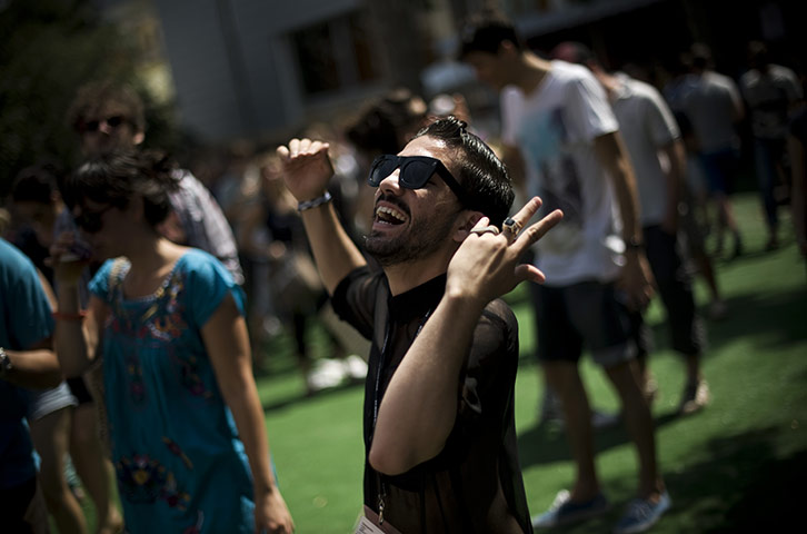 24 hours in pictures: A man dances while listening Toro y Moi during the Sonar 2011 Festival