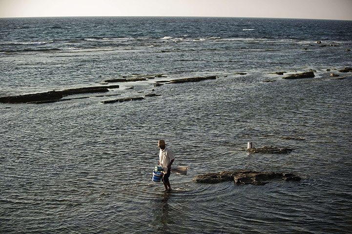 24 hours in pictures: benghazi fisherman