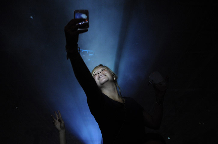 Sonar festival: A woman takes a picture of herself with a smartphone in La Coruna