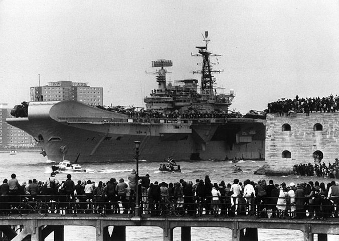 E Hamilton West: HMS Hermes leaving Portsmouth for the Falklands in April 1982