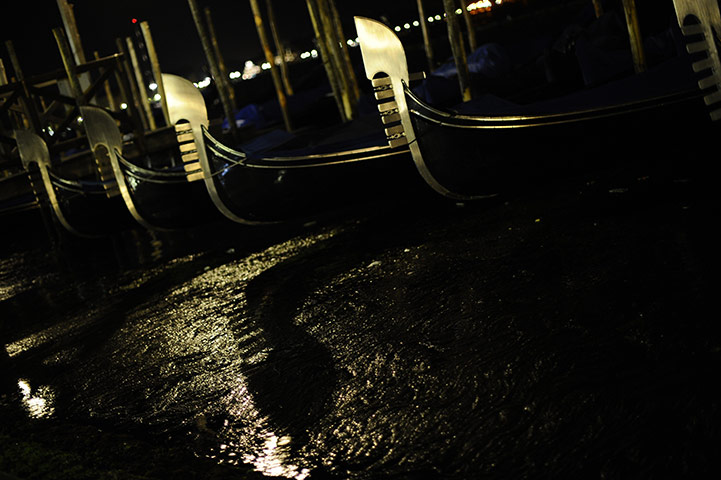 24 hours in pictures: Moored gondolas in a heavy evening rain shower