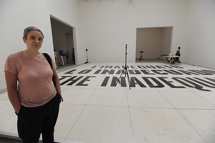 Venice Biennale: Dora Garcia poses front her artwork 'Lo Inadecuado' in Spain Pavillion