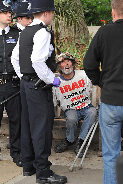 brian haw: Haw sits handcuffed before State Opening of Parliament