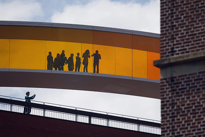 24 hours: Aarhus, Denmark: Visitors walk in Olafur Eliasson's Your Rainbow Panorama
