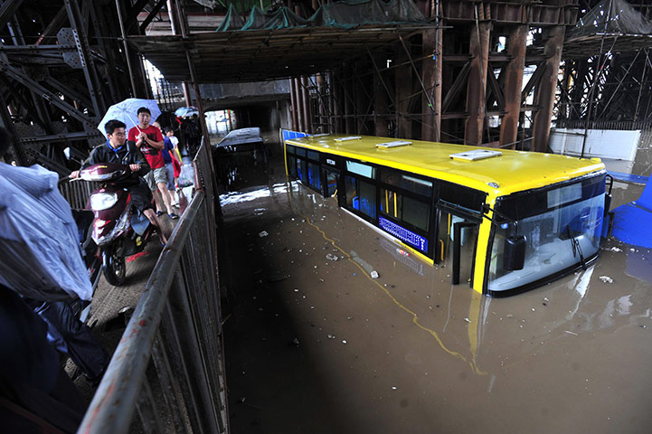 Floods in China: a bus trapped in the flood under an overpass in Wuhan
