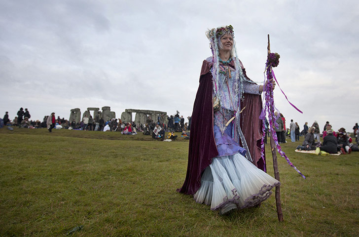 Summer solstice: A reveller at Stonehenge as people gather to celebrate the pagan festival 
