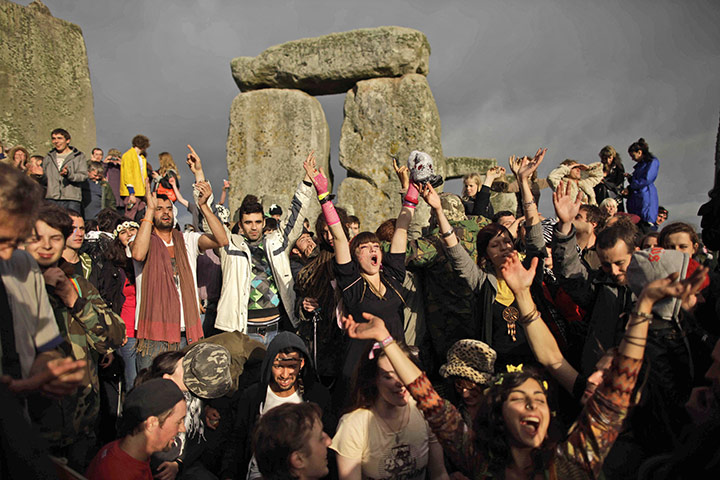 Summer solstice: Revellers cheer as the sun finally breaks through