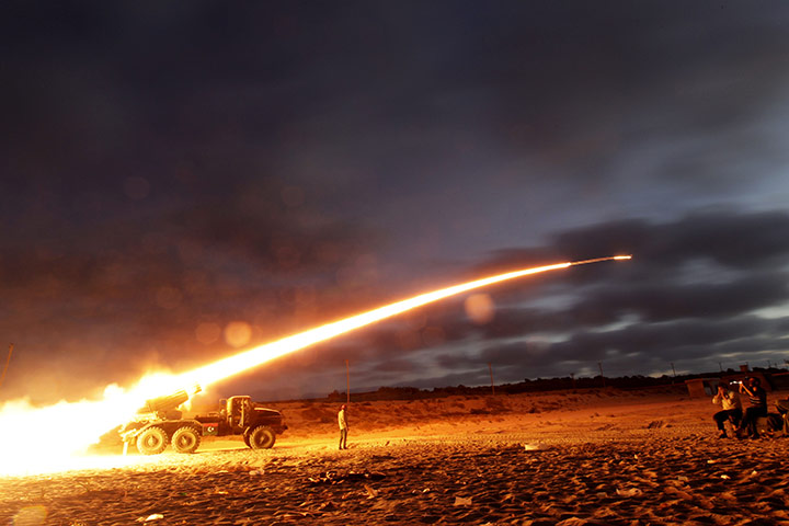 24 hours in pictures: Rebel fighters fire a Grad rocket in Libya