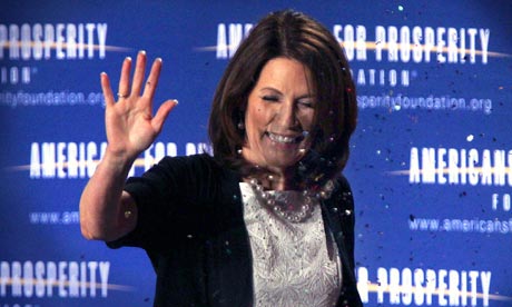 Republican presidential hopeful Michele Bachmann is showered with glitter, 18 June 2011. 