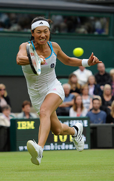 Wimbledon day 3: Kimko Date-Krumm attempts to return a shot to Venus Williams