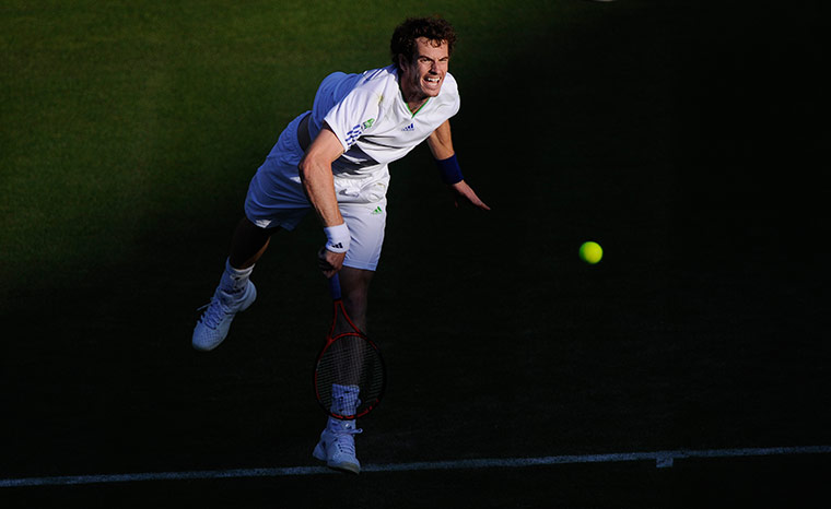 Wimbledon day 3: Andy Murray serves to Tobias Kamke