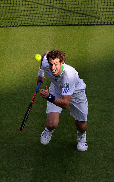 Wimbledon day 3: Andy Murray chases a shot from Tobias Kamke