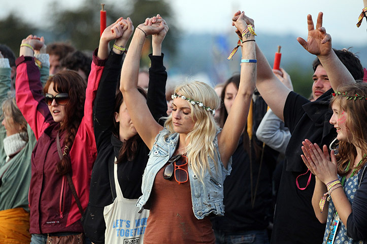 Glastonbury day 1: Festival goers gather at the Stone Circle to see the sun set 