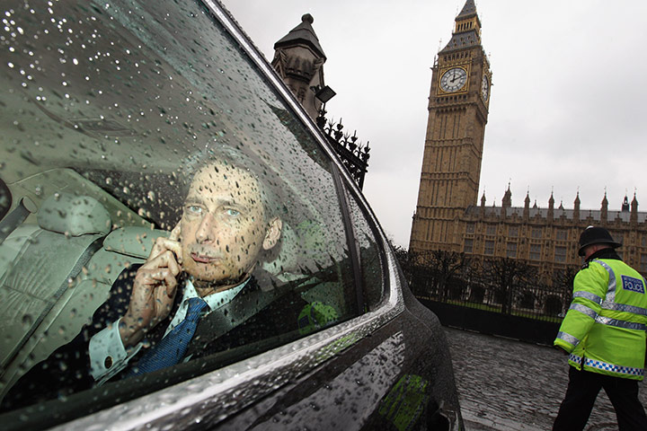 Week in Business:  Transport Secretary Philip Hammond leaves the Houses of Parliament
