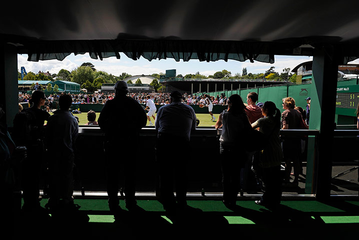 Wimbledon day 4: Spectators watch the action on court 11
