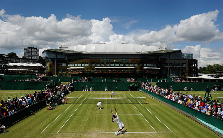 Wimbledon day 4: A doubles match begins play on Court 10 on a beautiful sunny morning