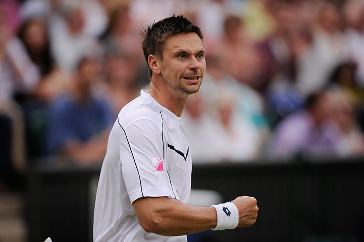 Wimbledon day 4: Robin Soderling celebrates in his match with Lleyton Hewitt 