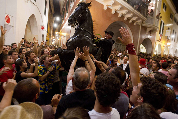 24 hours in pictures: A horse rider takes part in the traditional San Juan festival, Spain
