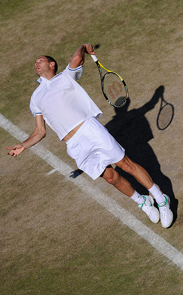 Wimbledon day 6: Michael Llodra serves to Ye-Hsun Lu