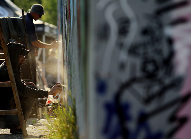 24 Hours: Rendez, Slovakia: Graffiti artists work at the Rendez Jam hip-hop festival