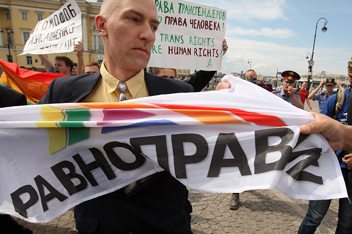 Gay Pride: A gay rights activist holds a poster in St Petersburg