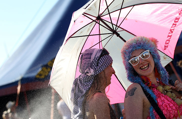 Hot Weather: Festival-goers shelter from the sun