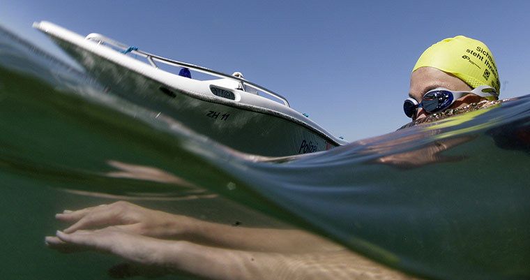 24 hours in pictures: a swimmer on Lake Zurich