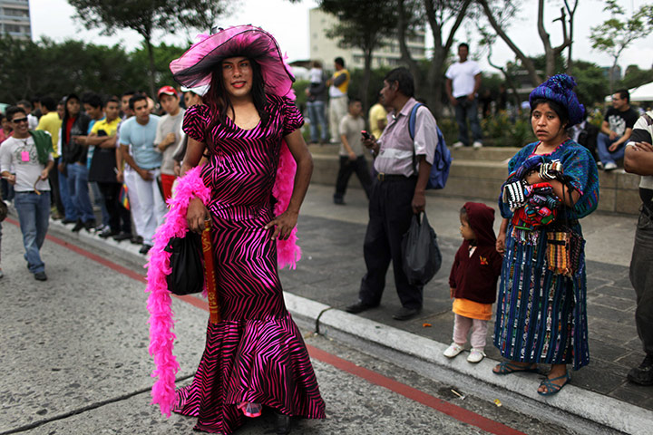 24 hours in pictures: a transgender person takes part in Gay Pride parade 