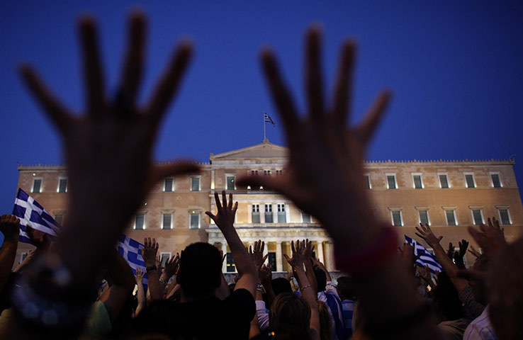 24 hours in pictures: protesters gesture in front of the Greek parliament