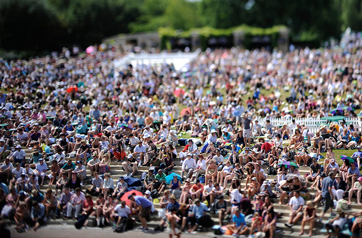 Day Seven Update: Wimbledon tennis crowd on Henman Hill watch the Andy Murray match 