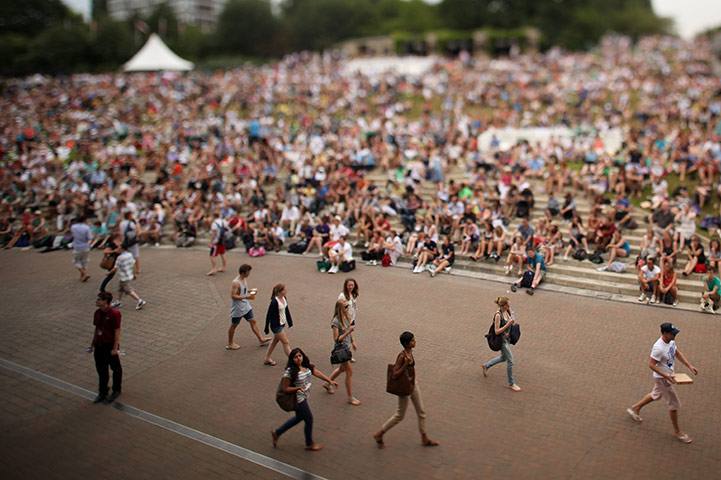 24 hours in pictures: Spectators watching a match on the big screen, Wimbledon Championships