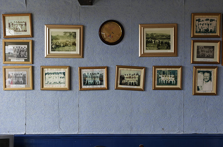 Veteran Cricketers: Pictures of cricket teams hung on the wall