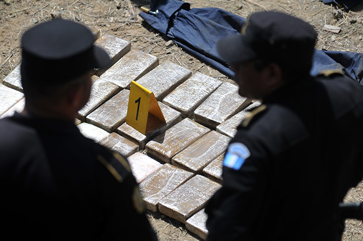 Guatemala gang wars: Officers of the Civil National Police guard cocaine