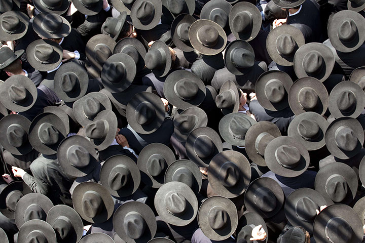 24 hours in pictures: Ultra Orthodox Jews attend the funeral