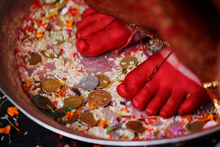 24 hours in pictures: The feet of Living Goddess Kumari at Bhotojatra festival in Lalitpur