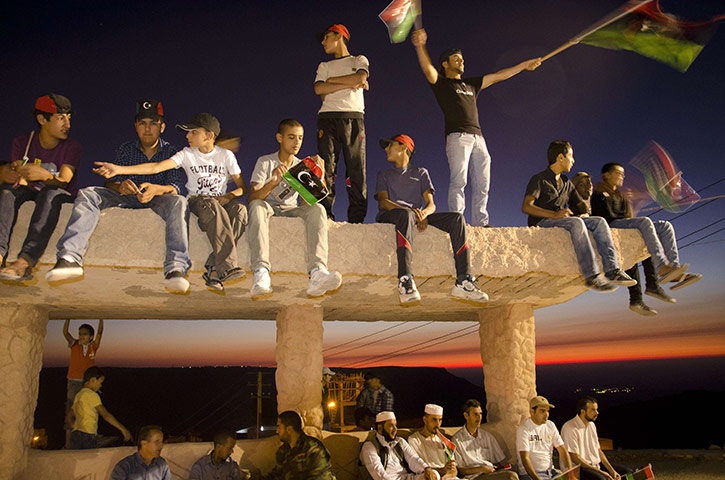 24 hours in pictures: Libyan youths wave the rebellion's flag