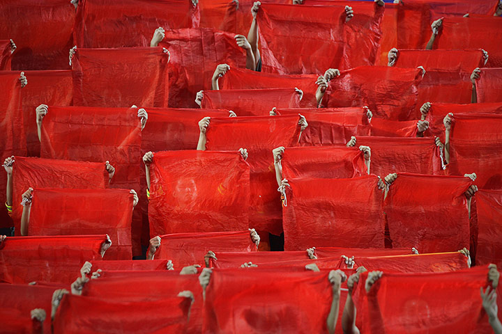 24 hours in pictures: Dancers perform during a gala show  in the Great Hall of the People, China